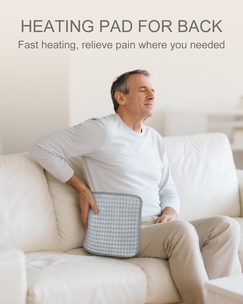 Person using a heating pad on lower back for safe heat therapy pain relief
