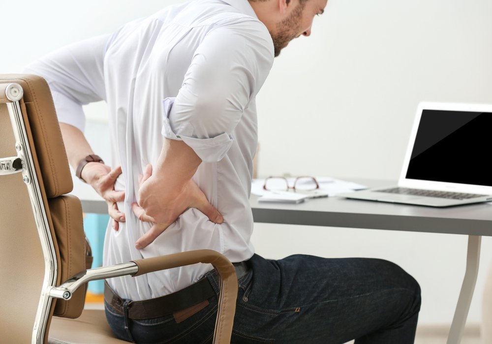 lower back pain caused by sitting too long