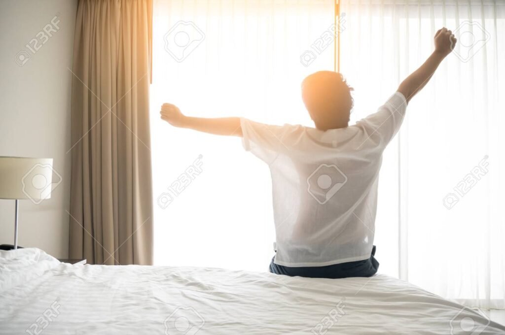 person stretching in morning sunlight