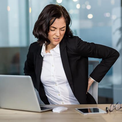 Lower back pain from sitting too long at desk
